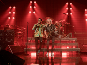 Queen and Adam Labert performing during an event in Villa Bibbiani